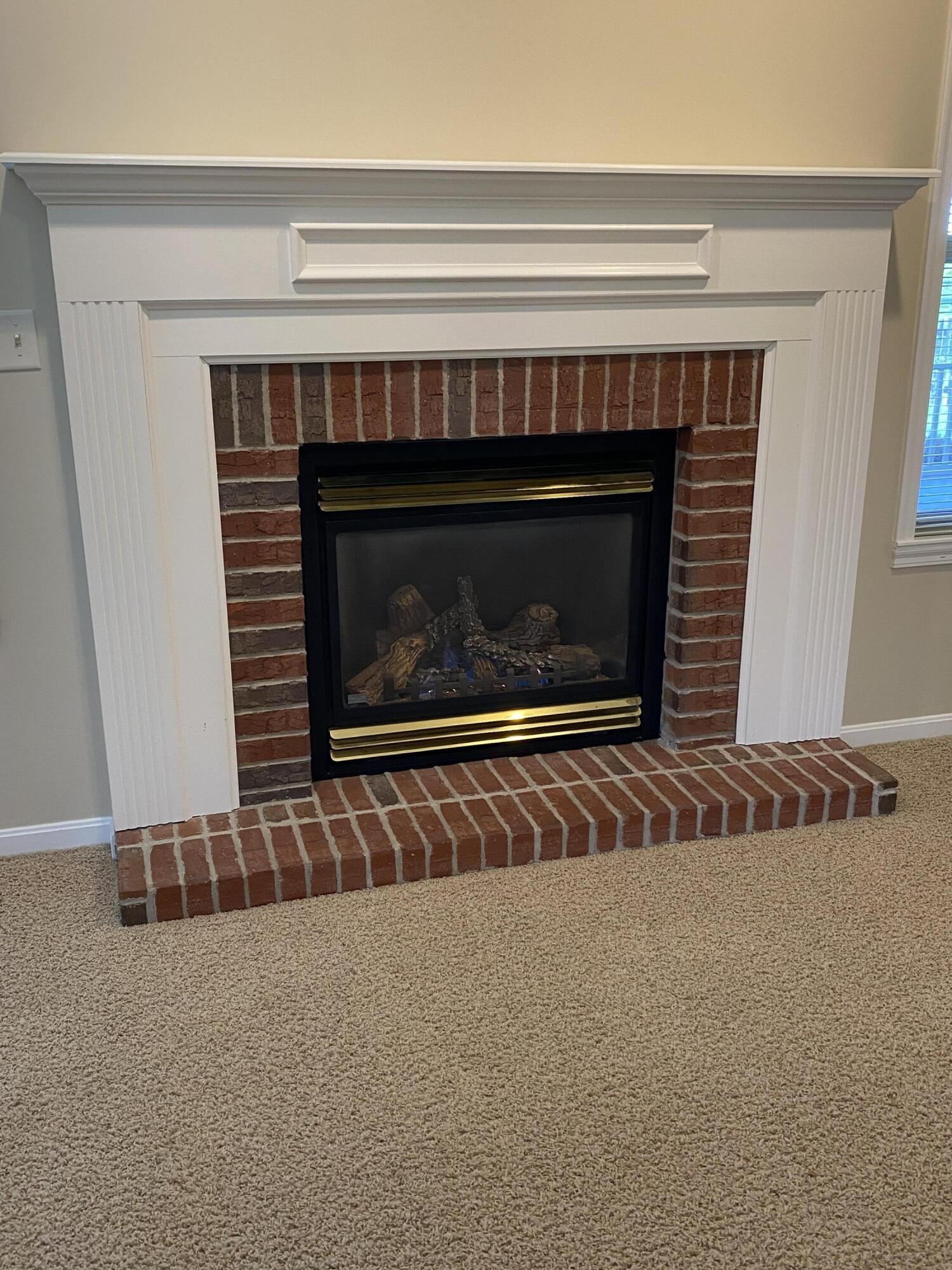 8964 Richmond Road Union, KY 41091 - Photo 10 of 48 Custom built brick surround and hearth with custom wood trimmed mantel.