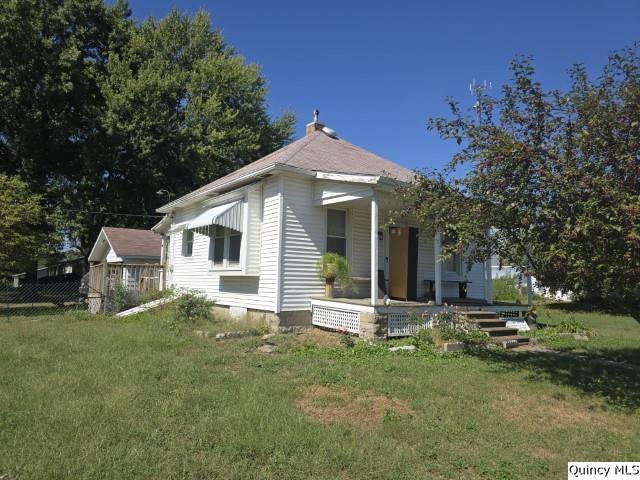 201 Laurel Street Elvaston, IL 62334 - Photo 15 of 17 a front view of house with yard and green space