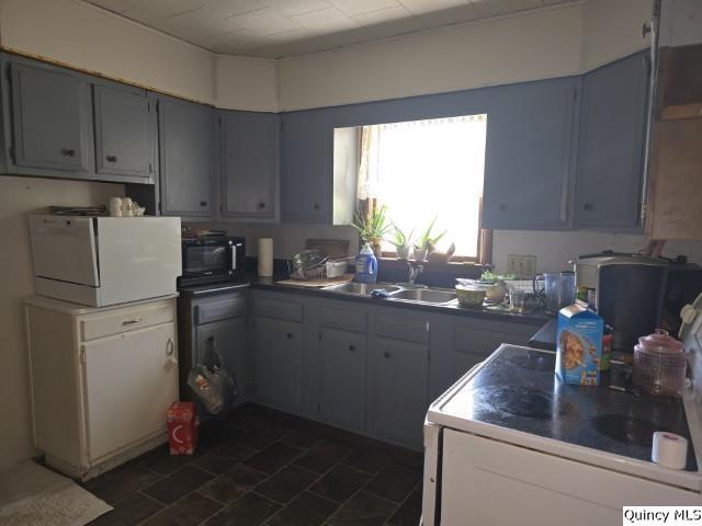 201 Laurel Street Elvaston, IL 62334 - Photo 4 of 17 a kitchen with a sink cabinets and window