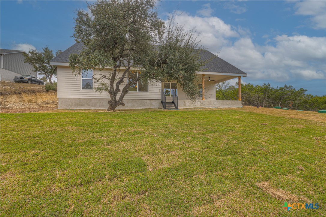 328 Compass Rose Spring Branch, TX 78070 - Photo 46 of 48 a view of a house with a yard