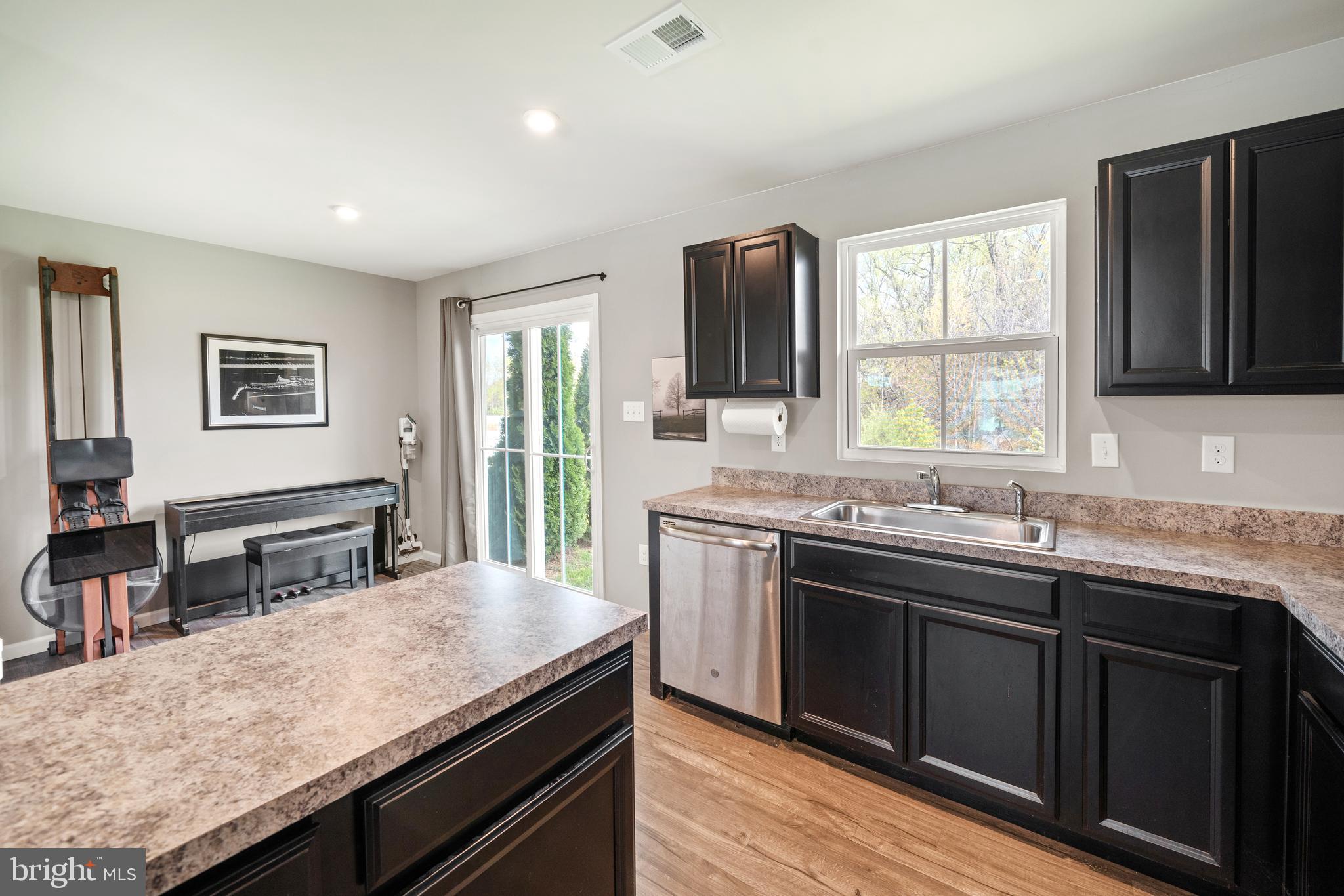 141 Wye Oak Drive Townsend, DE 19734 - Photo 11 of 32 a kitchen with a stove and a sink