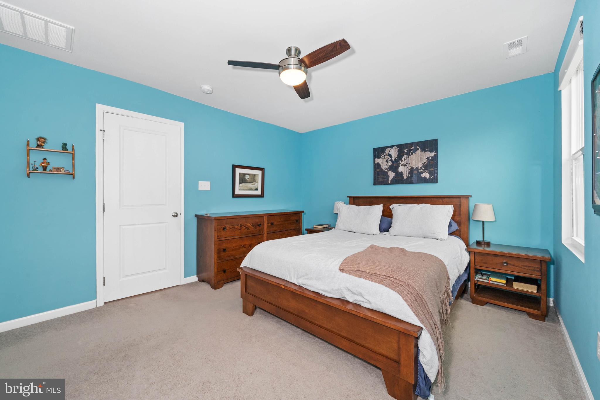 141 Wye Oak Drive Townsend, DE 19734 - Photo 18 of 32 a spacious bedroom with a bed and a ceiling fan