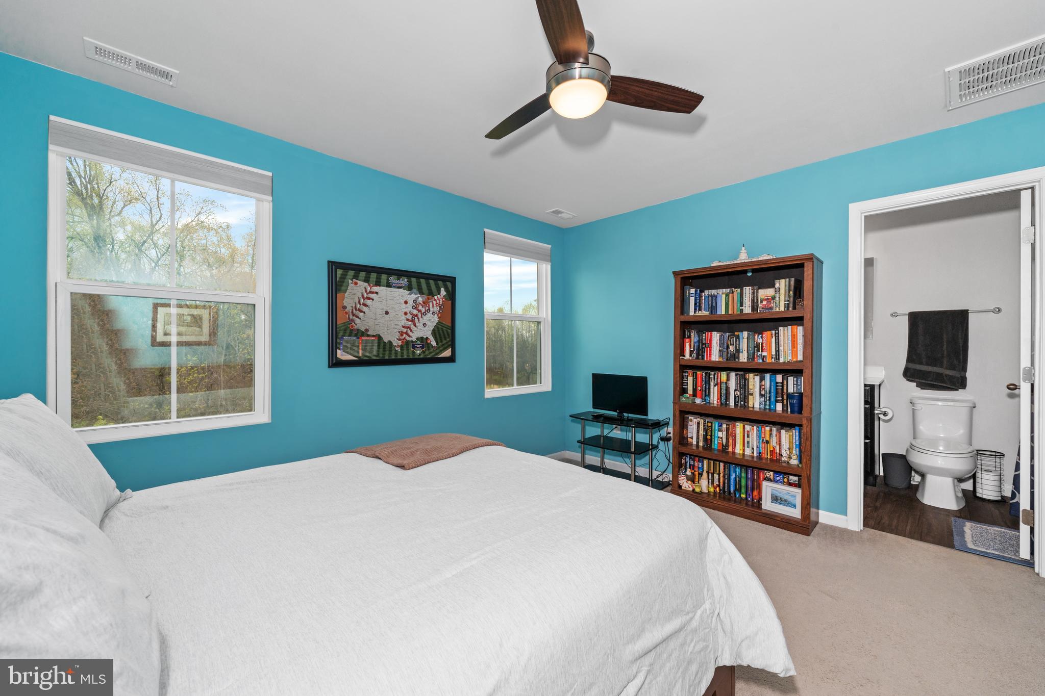 141 Wye Oak Drive Townsend, DE 19734 - Photo 19 of 32 a bedroom with a large bed and a book shelf