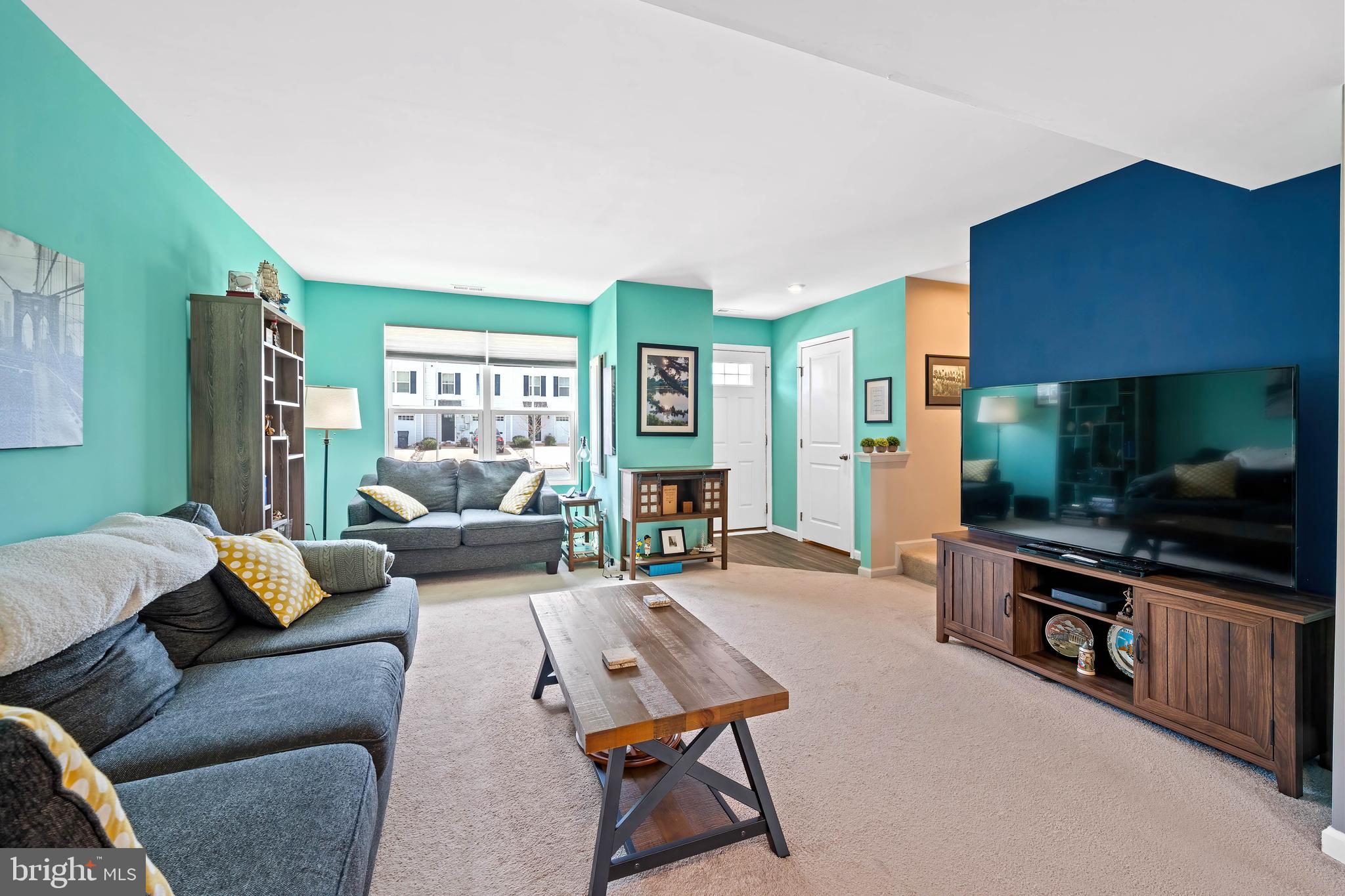 141 Wye Oak Drive Townsend, DE 19734 - Photo 5 of 32 a living room with furniture and a flat screen tv