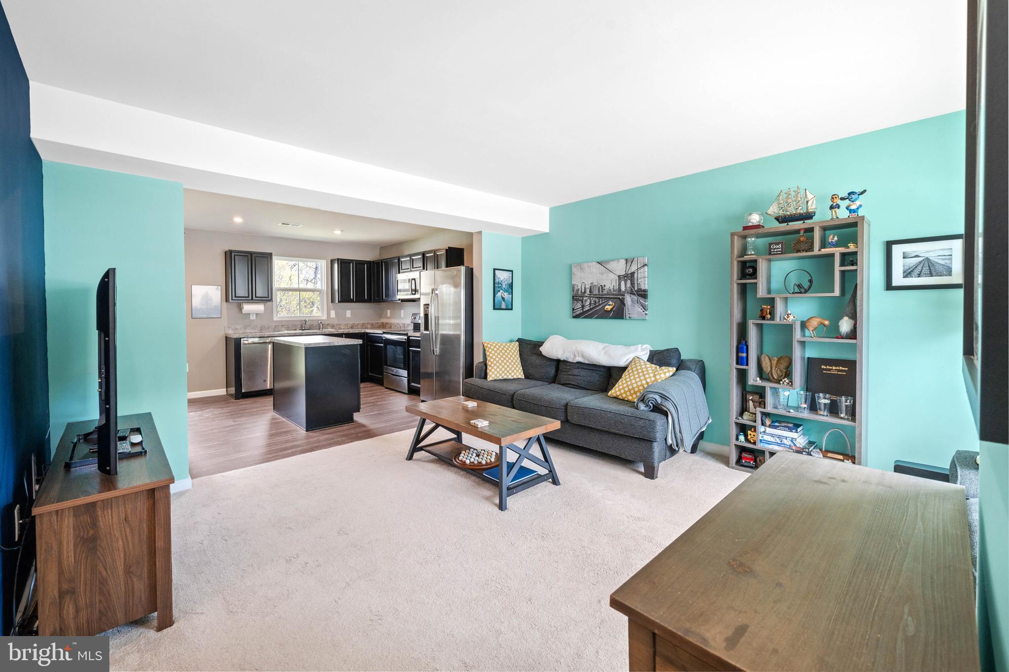 141 Wye Oak Drive Townsend, DE 19734 - Photo 7 of 32 a living room with furniture and a fireplace
