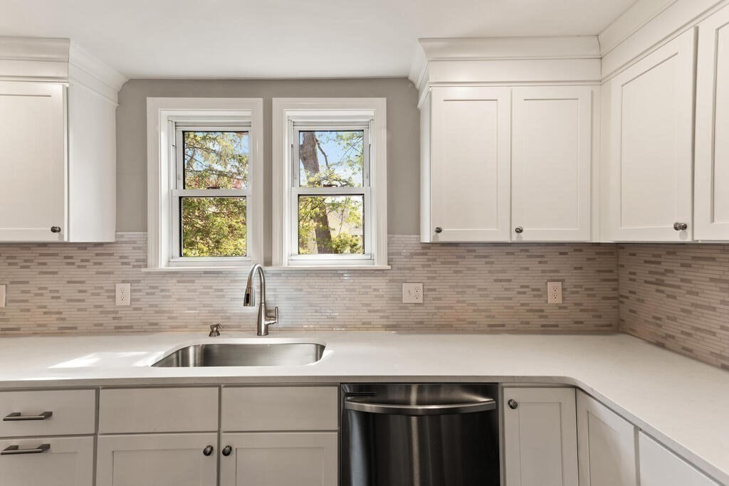 48 Pinewood Avenue Billerica, MA 01821 - Photo 16 of 26 a kitchen with a sink and cabinets