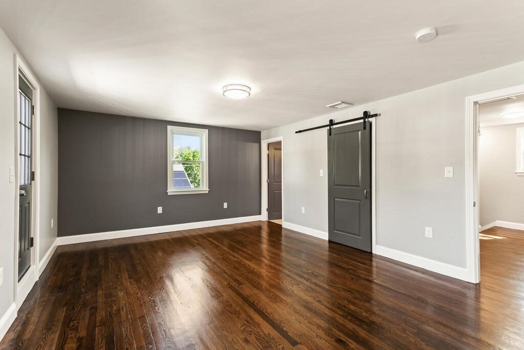 48 Pinewood Avenue Billerica, MA 01821 - Photo 18 of 26 an empty room with wooden floor and windows