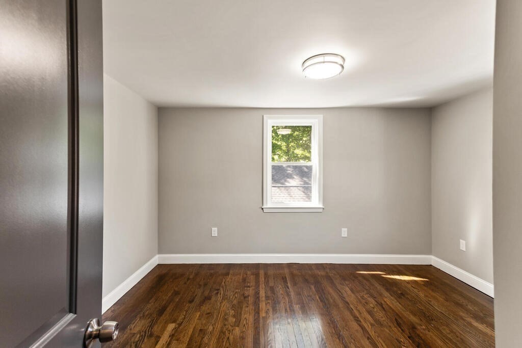 48 Pinewood Avenue Billerica, MA 01821 - Photo 20 of 26 an empty room with wooden floor and windows
