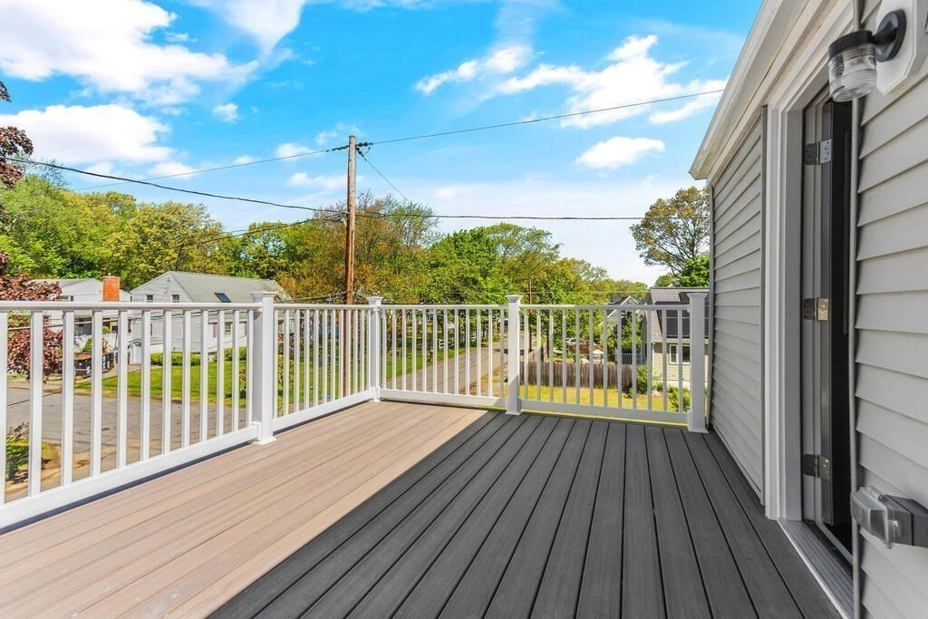 48 Pinewood Avenue Billerica, MA 01821 - Photo 2 of 26 a view of a balcony with wooden floor and fence