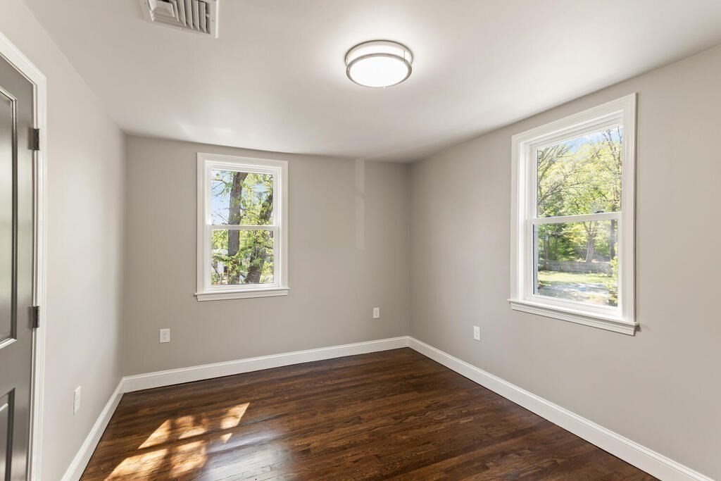 48 Pinewood Avenue Billerica, MA 01821 - Photo 21 of 26 a view of an empty room with wooden floor and a window