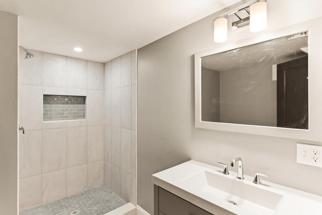 48 Pinewood Avenue Billerica, MA 01821 - Photo 25 of 26 a bathroom with a sink and a mirror