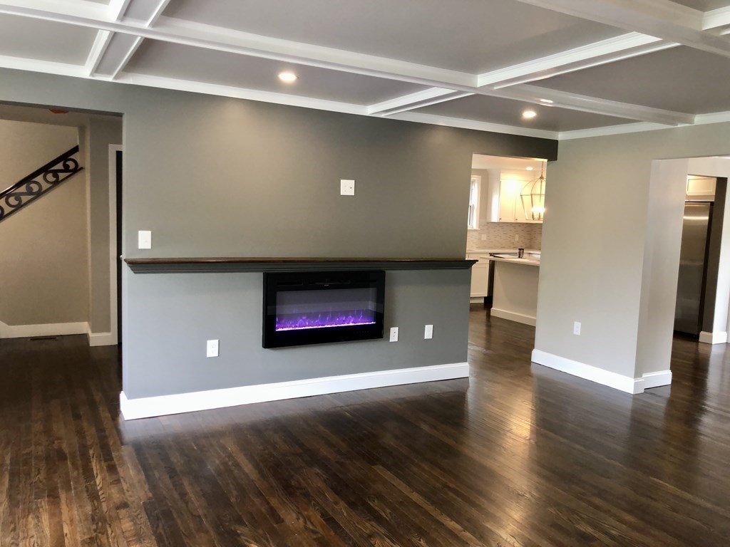 48 Pinewood Avenue Billerica, MA 01821 - Photo 5 of 26 a view of an empty room with wooden floor and a window