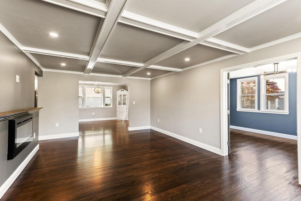 48 Pinewood Avenue Billerica, MA 01821 - Photo 6 of 26 a view of an empty room with wooden floor and a window