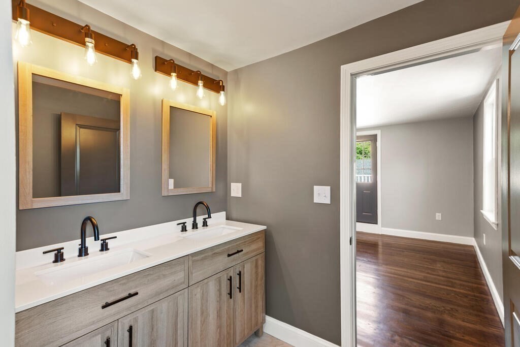 48 Pinewood Avenue Billerica, MA 01821 - Photo 7 of 26 a en suite bathroom with a double vanity sink and a mirror