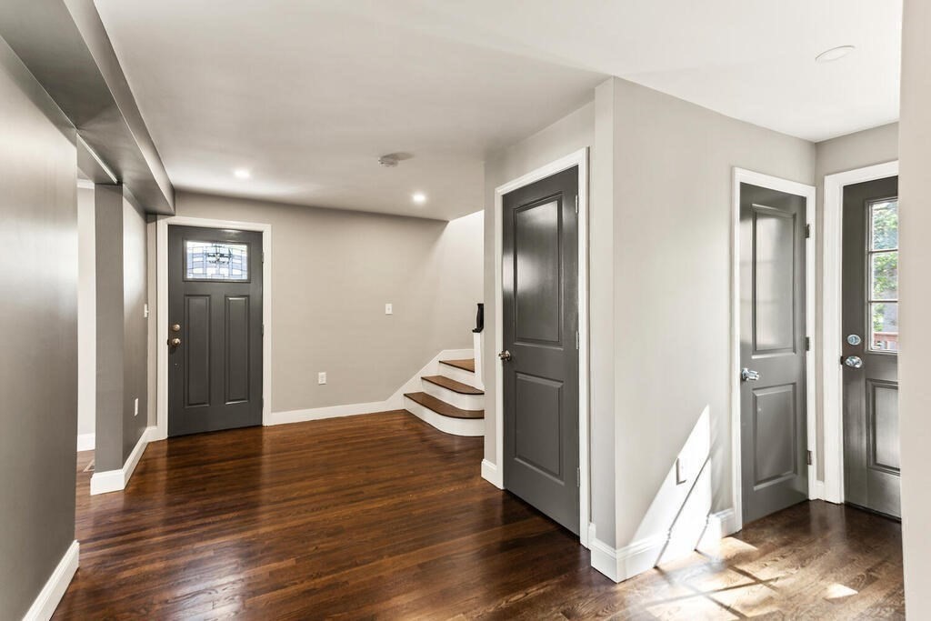 48 Pinewood Avenue Billerica, MA 01821 - Photo 8 of 26 a view of a hallway with wooden floor and a living room