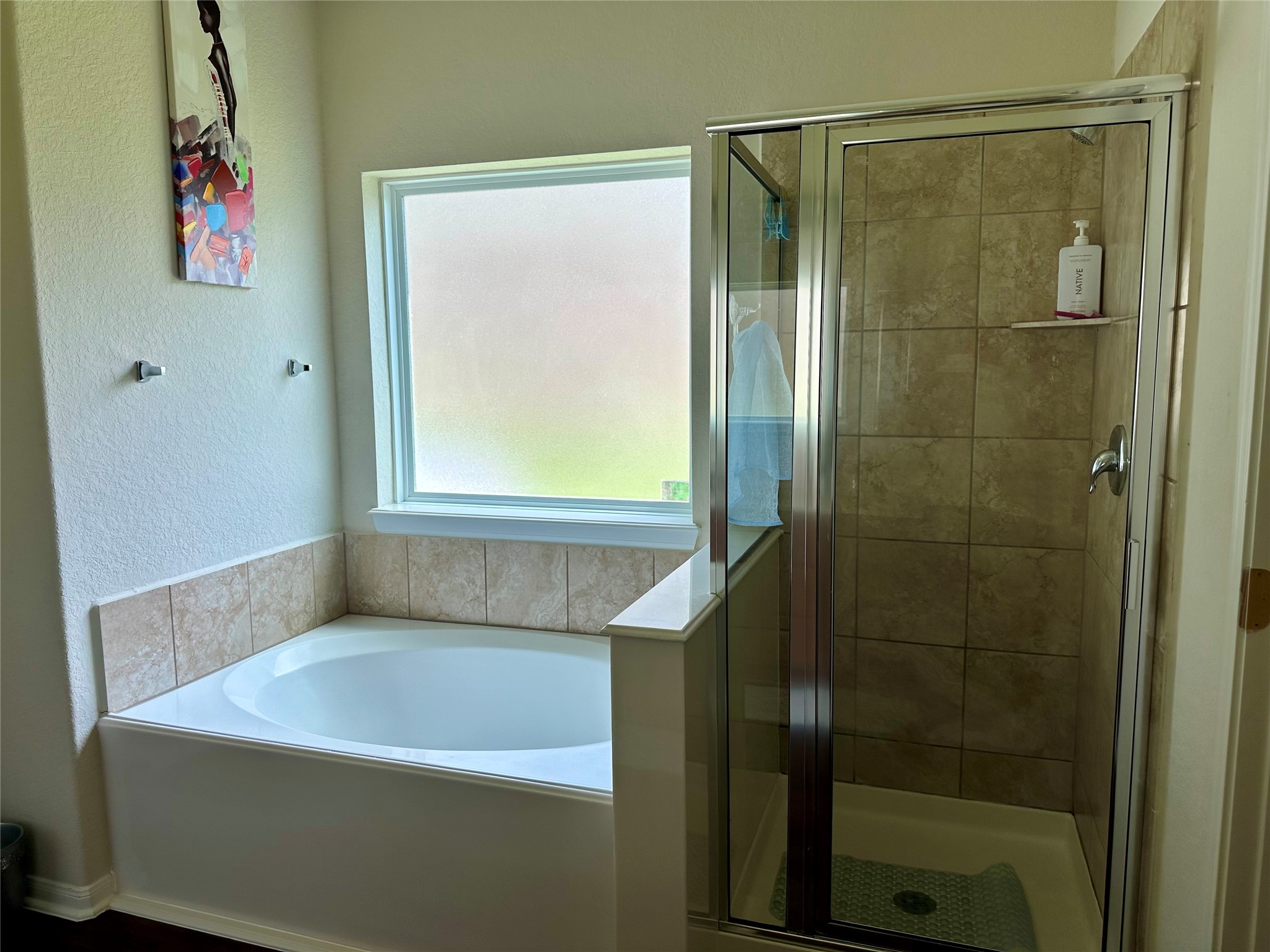 18622 Each Elm Way Houston, TX 77084 - Photo 18 of 35 a bathroom with a bathtub and a shower