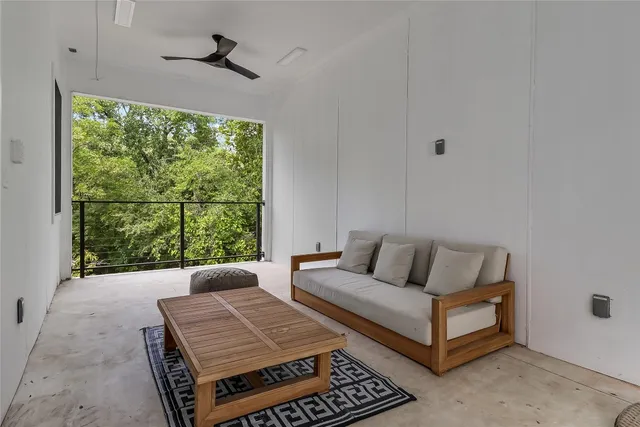 a living room with furniture and a window