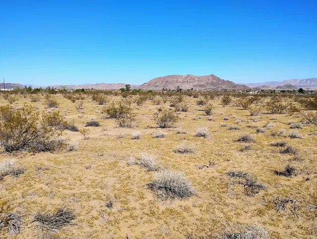 a view of a large body of water with a building in the background