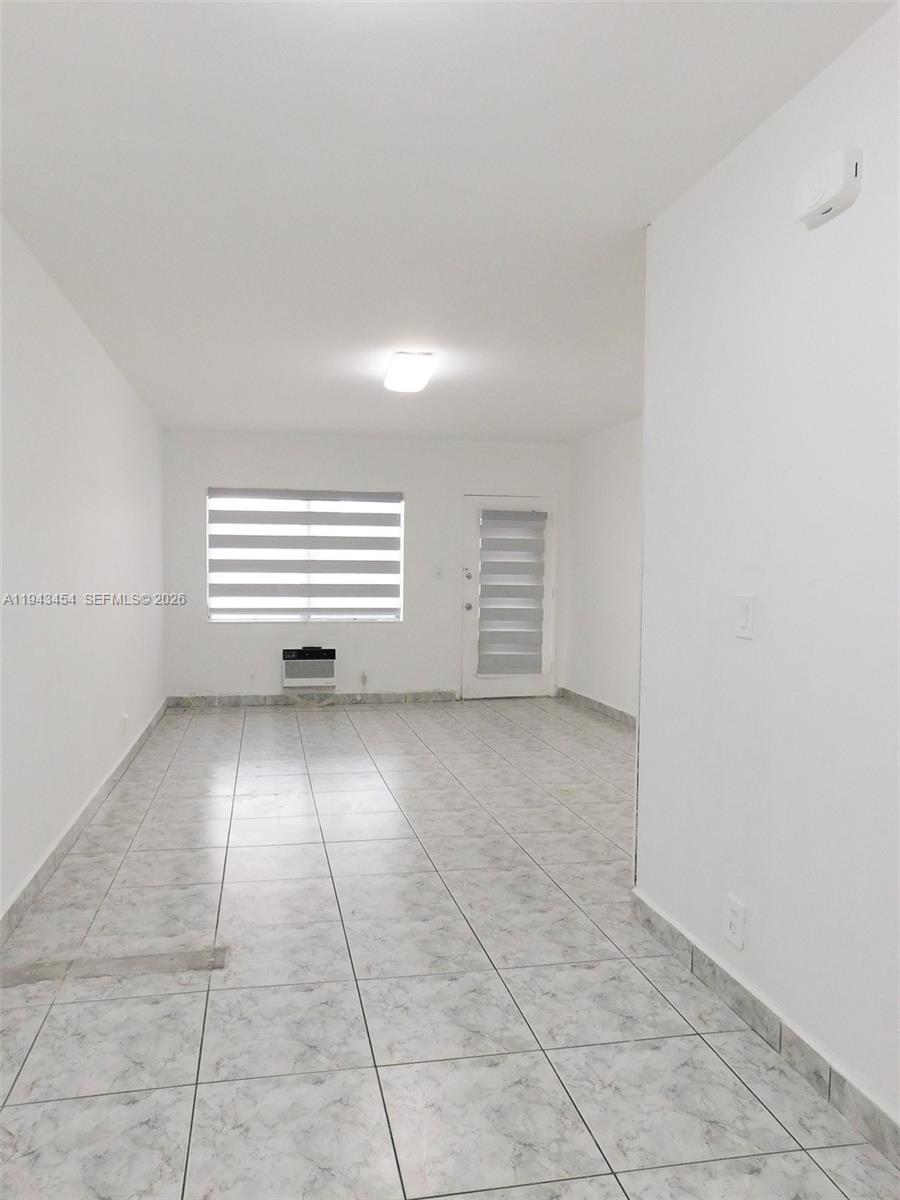 7840 Harding Avenue, Unit 2 Miami Beach, FL 33141 - Photo 5 of 19 a view of a room that has a window in it