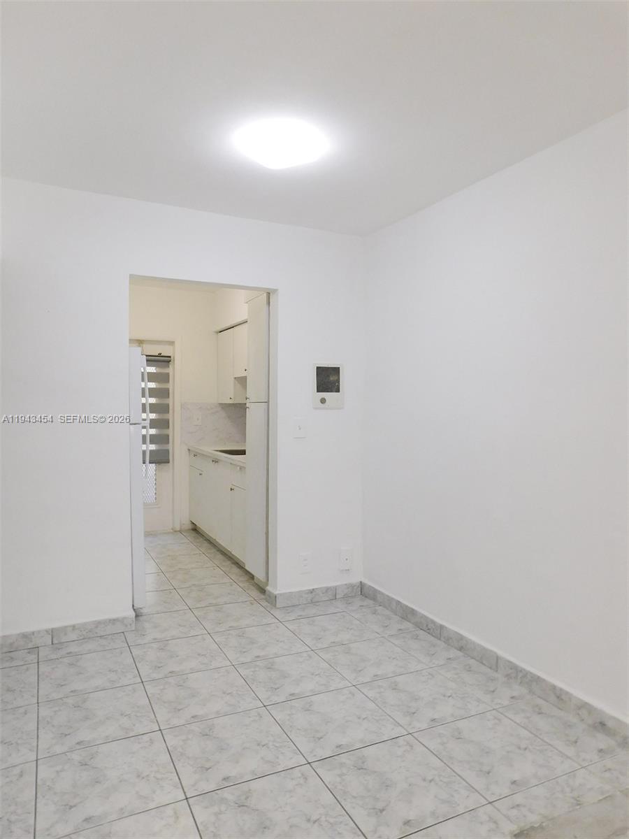 7840 Harding Avenue, Unit 2 Miami Beach, FL 33141 - Photo 8 of 19 an empty room with a empty space