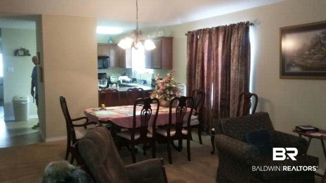 8877 Fall Court Mobile, AL 36695 - Photo 10 of 27 Two large windows and a patio door bring natural light into the great room.