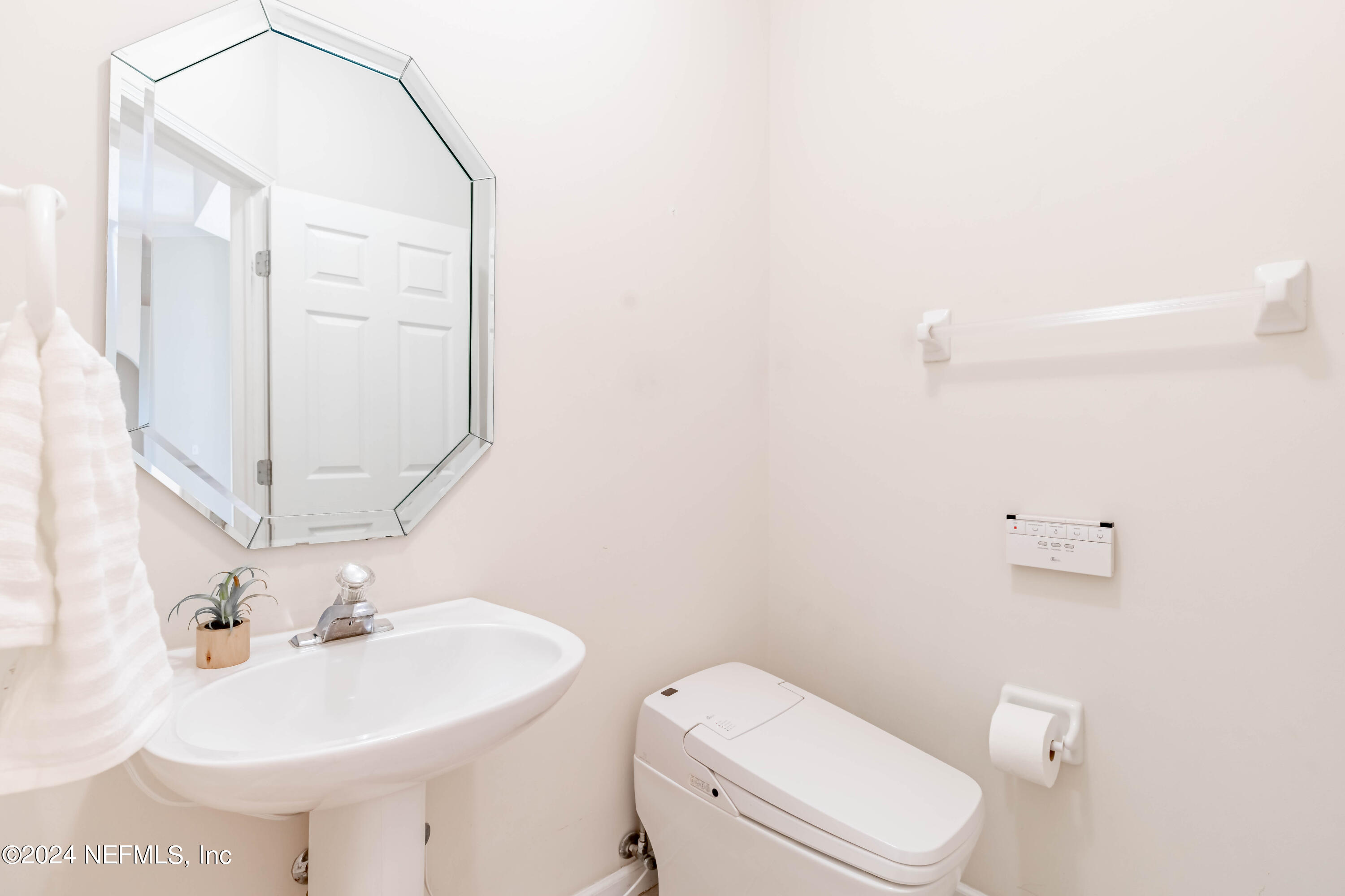 2285 Eagle Harbor Parkway Fleming Island, FL 32003 - Photo 19 of 59 a bathroom with a sink a toilet and mirror
