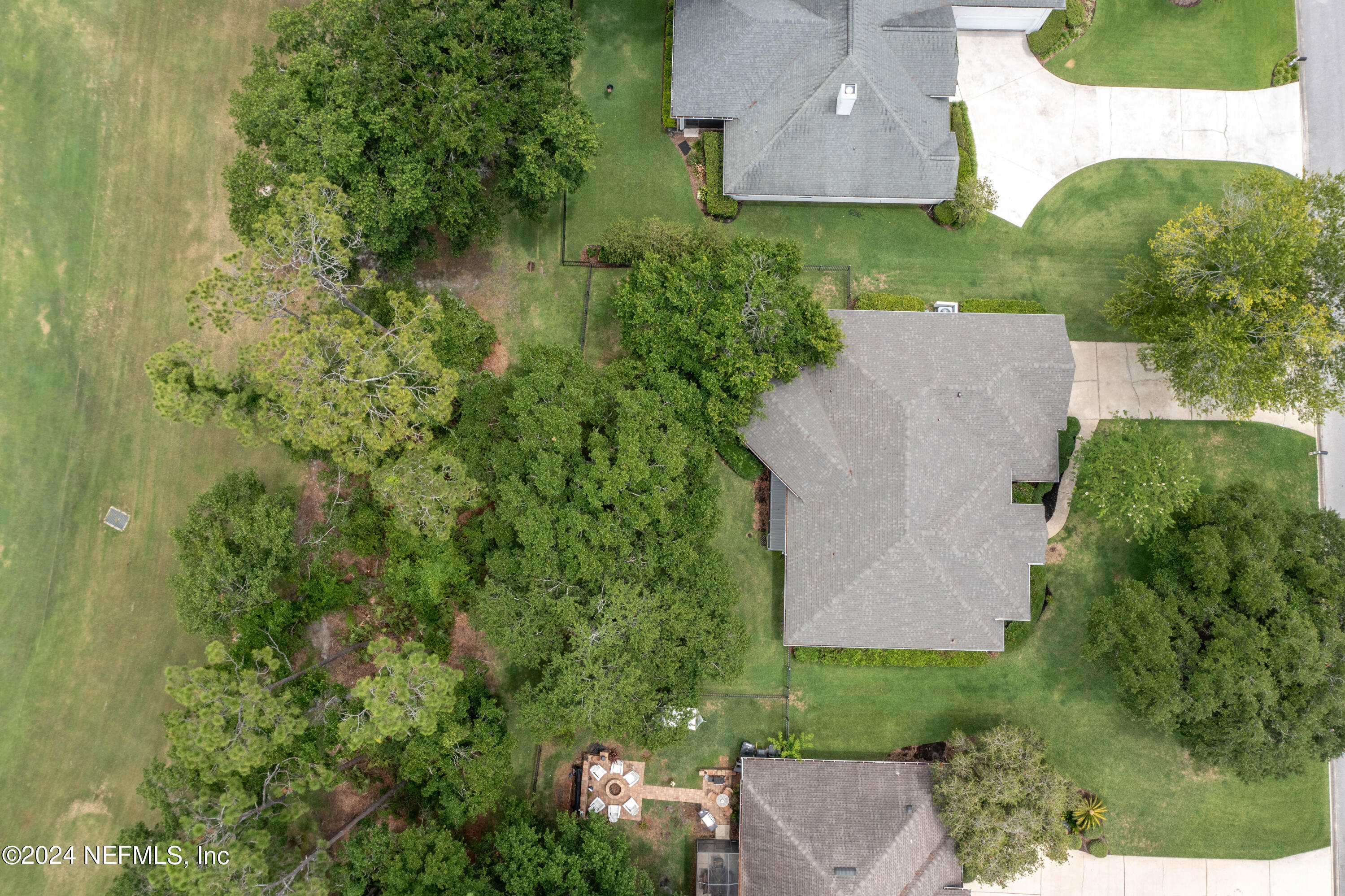 2285 Eagle Harbor Parkway Fleming Island, FL 32003 - Photo 25 of 59 an aerial view of a house with a yard and trees all around