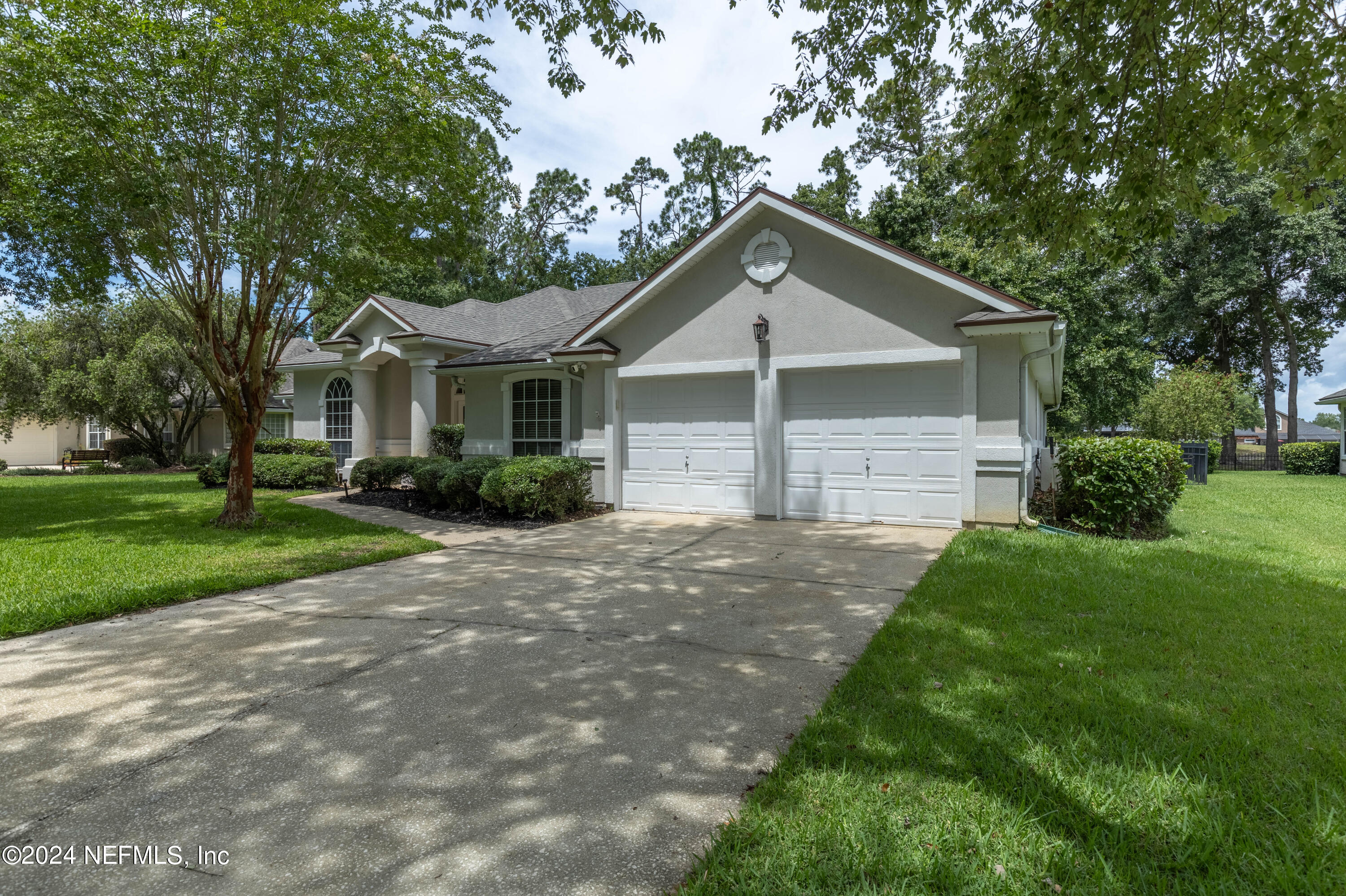 2285 Eagle Harbor Parkway Fleming Island, FL 32003 - Photo 29 of 59 a front view of a house with a yard and garage