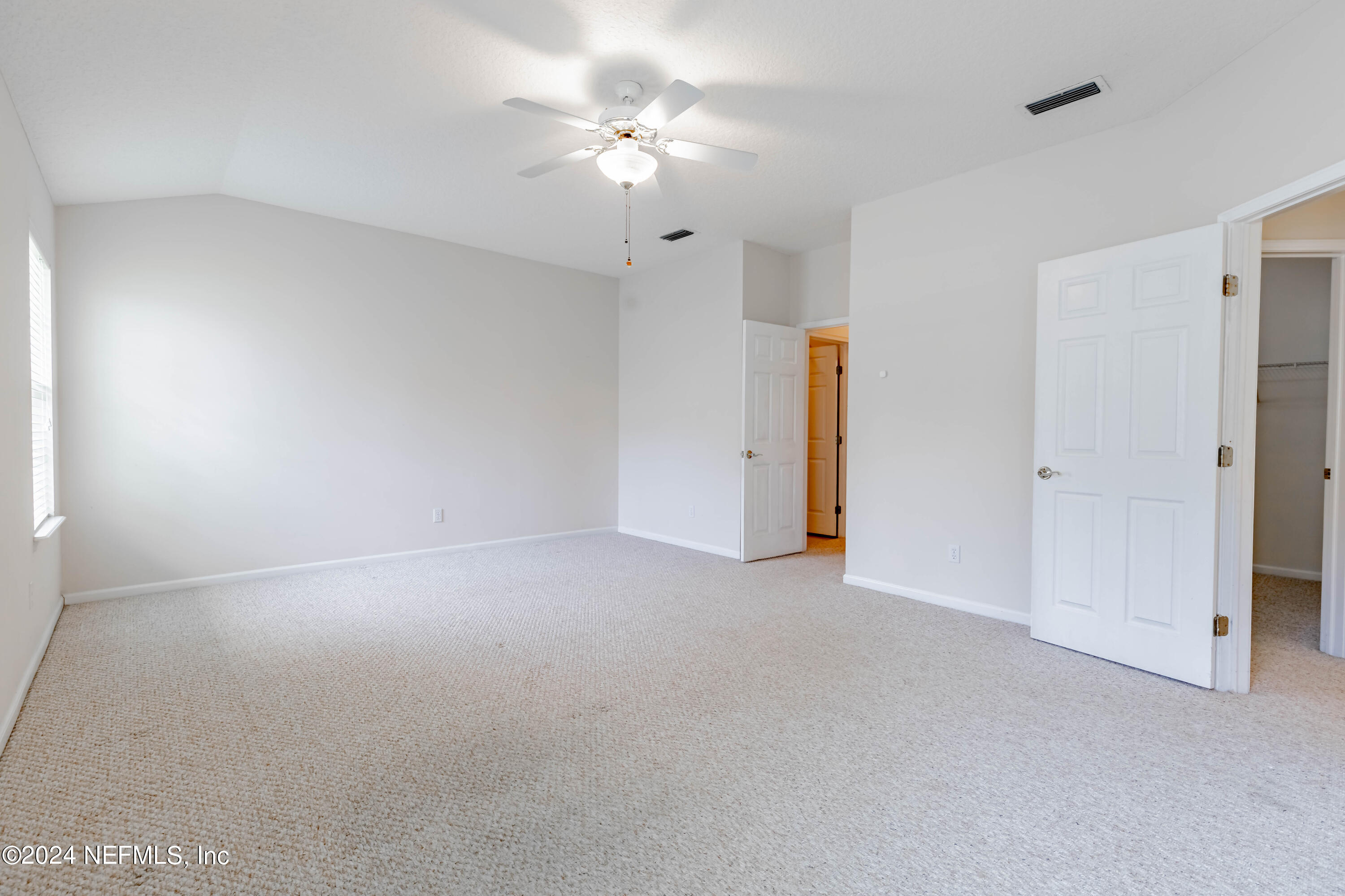 2285 Eagle Harbor Parkway Fleming Island, FL 32003 - Photo 47 of 59 a view of an empty room with a ceiling fan