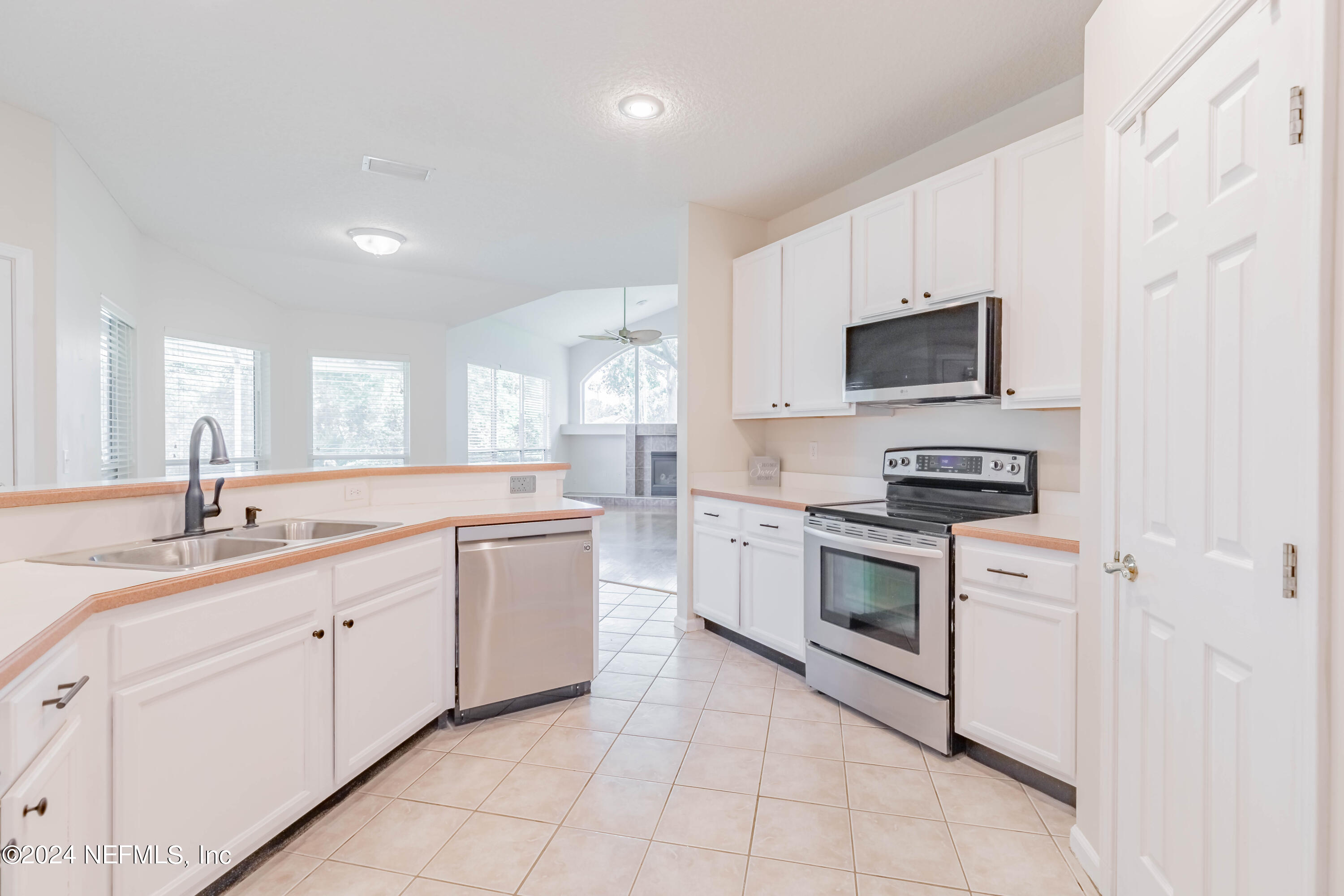 2285 Eagle Harbor Parkway Fleming Island, FL 32003 - Photo 7 of 59 a kitchen with appliances cabinets and a sink