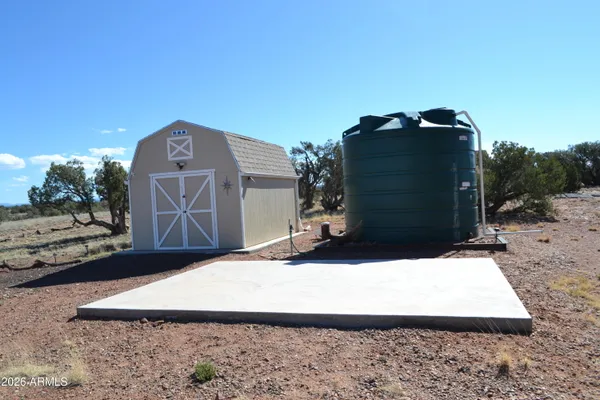 a view of a back yard of the house