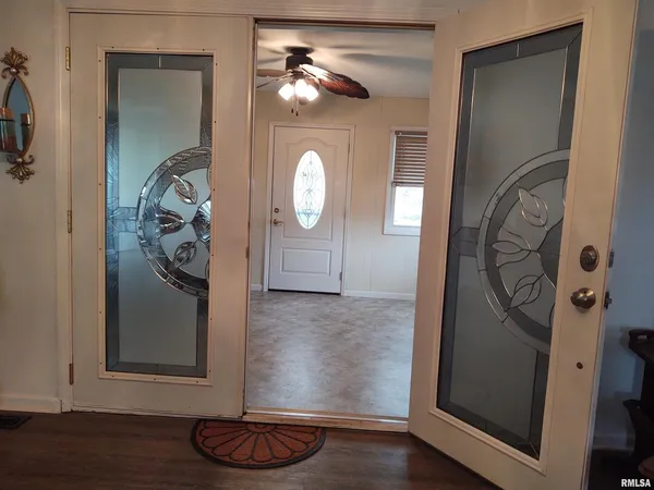 a view of entryway with wooden floor