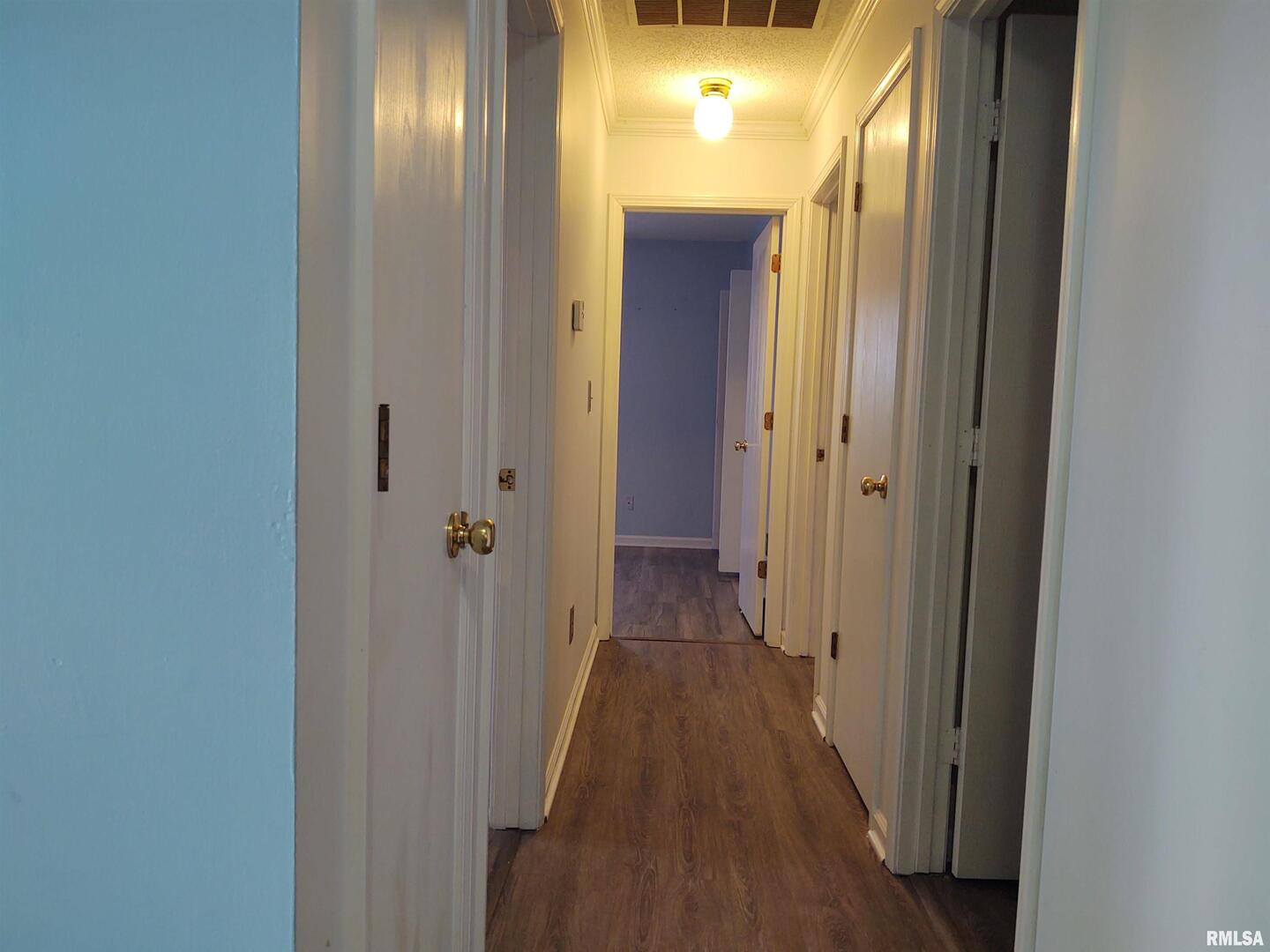 110 Stork Street Anna, IL 62906 - Photo 18 of 27 a view of a hallway with wooden floor