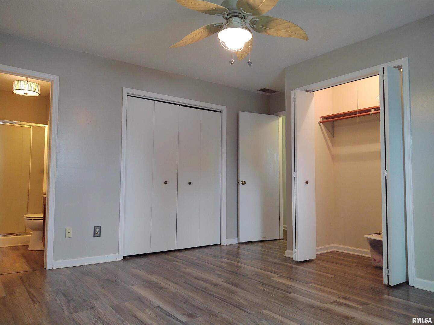 110 Stork Street Anna, IL 62906 - Photo 19 of 27 a view of an empty room with wooden floor and a window