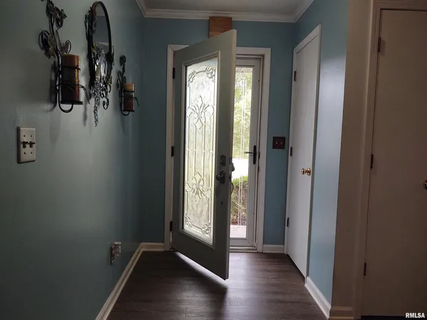 a view of entryway with wooden floor