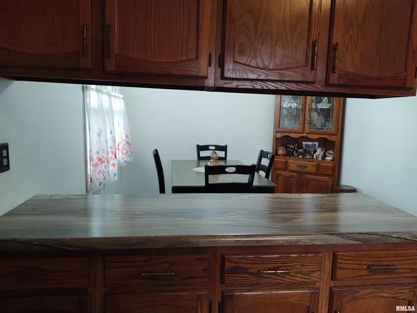 a kitchen with granite countertop stainless steel appliances a sink and cabinets