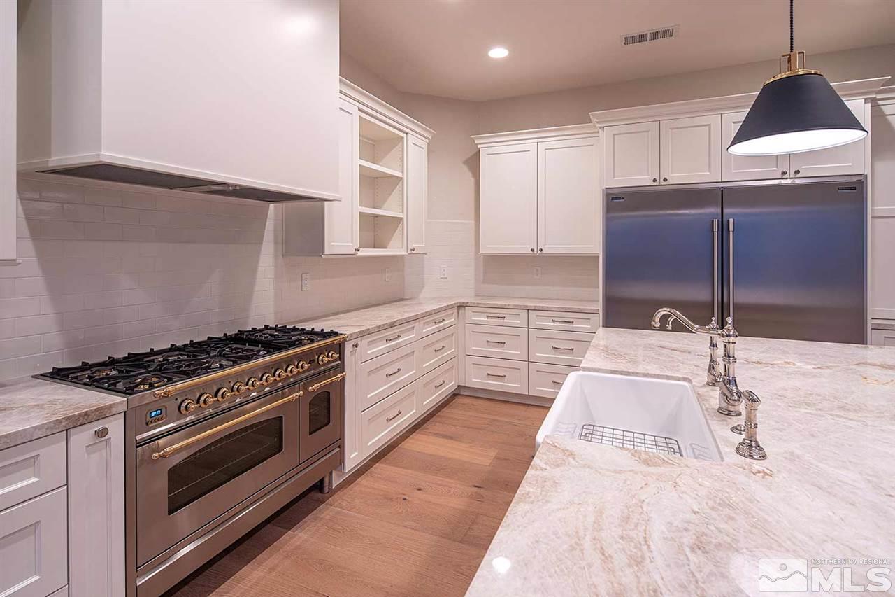 770 Sandoval Road Reno, NV 89511 - Photo 7 of 32 a kitchen with a stove and a wooden floor