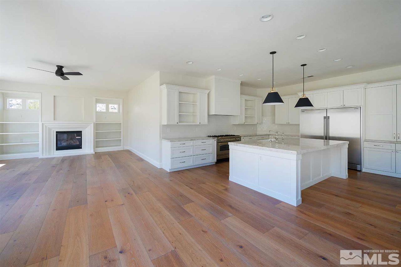 770 Sandoval Road Reno, NV 89511 - Photo 10 of 32 a large kitchen with cabinets wooden floor and stainless steel appliances