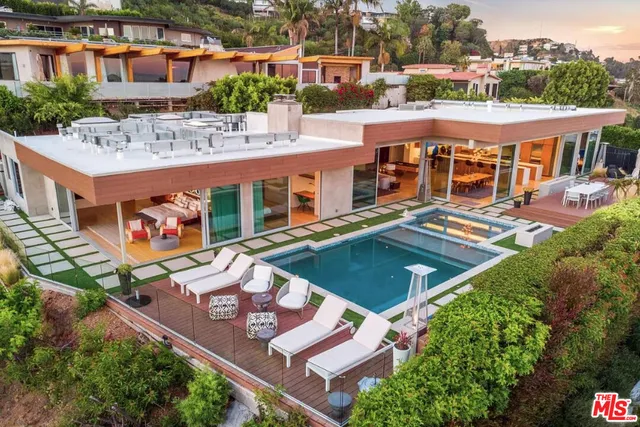 an aerial view of a house with swimming pool