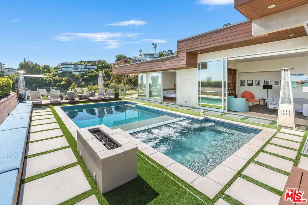 1429 Devlin Drive Los Angeles, CA 90069 - Photo 18 of 58 a view of a house with swimming pool and sitting area