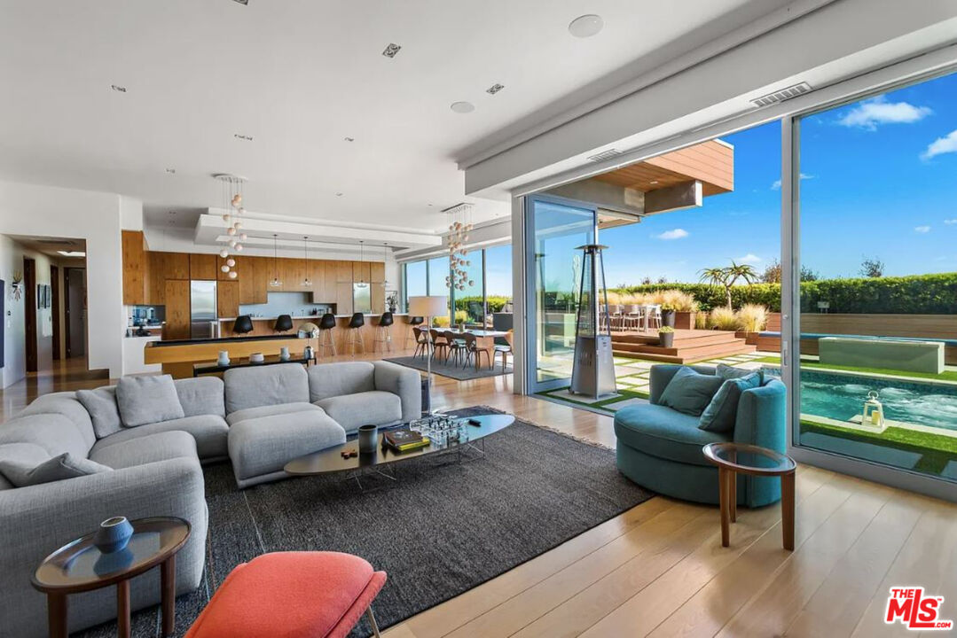 1429 Devlin Drive Los Angeles, CA 90069 - Photo 21 of 58 a living room with furniture and a floor to ceiling window
