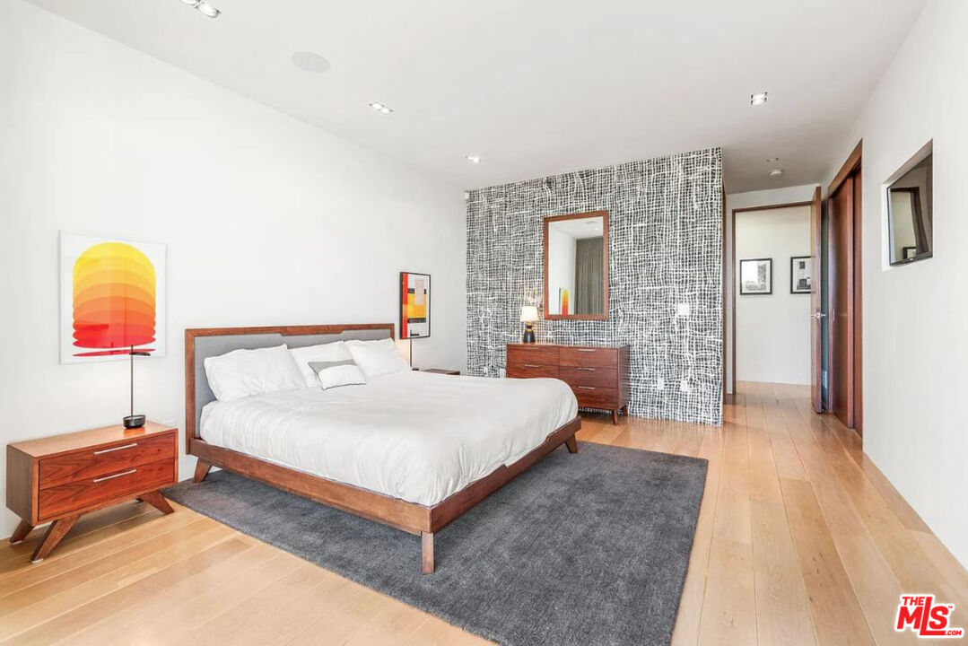 1429 Devlin Drive Los Angeles, CA 90069 - Photo 24 of 58 a spacious bedroom with a bed and window