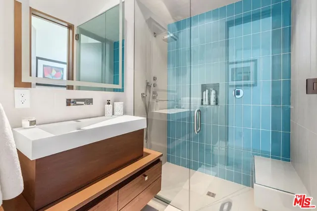 a view of a balcony with two chairs and a table