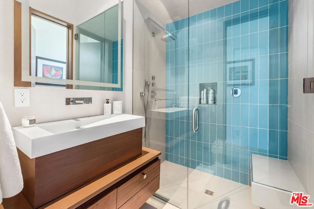 1429 Devlin Drive Los Angeles, CA 90069 - Photo 28 of 58 a bathroom with a sink and a mirror