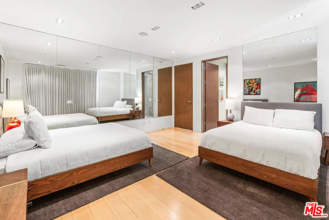 1429 Devlin Drive Los Angeles, CA 90069 - Photo 3 of 58 a spacious bedroom with a bed and a couch