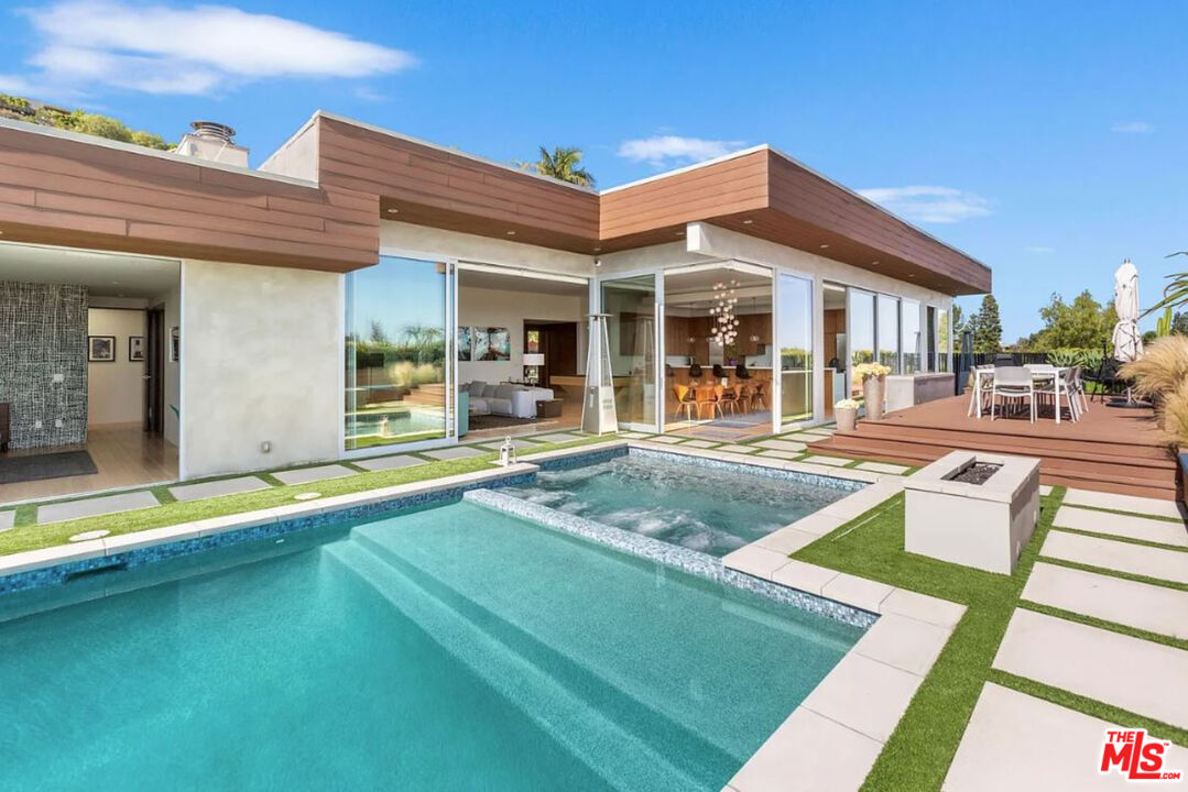 1429 Devlin Drive Los Angeles, CA 90069 - Photo 37 of 58 a view of a house with swimming pool and sitting area