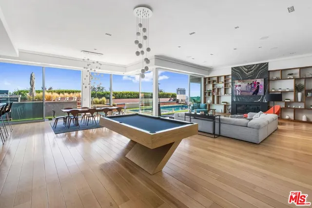 a view of swimming pool with seating area