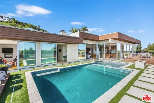 a bathroom with a tub sink toilet and mirror