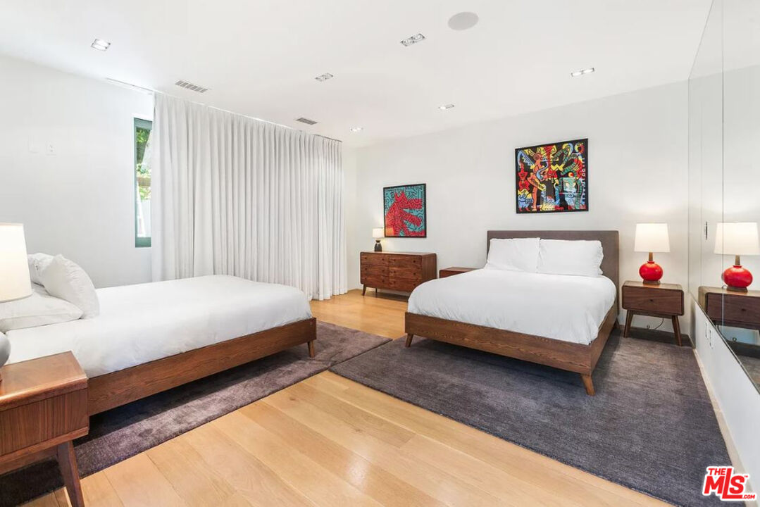 1429 Devlin Drive Los Angeles, CA 90069 - Photo 44 of 58 a bedroom with a bed and a couch