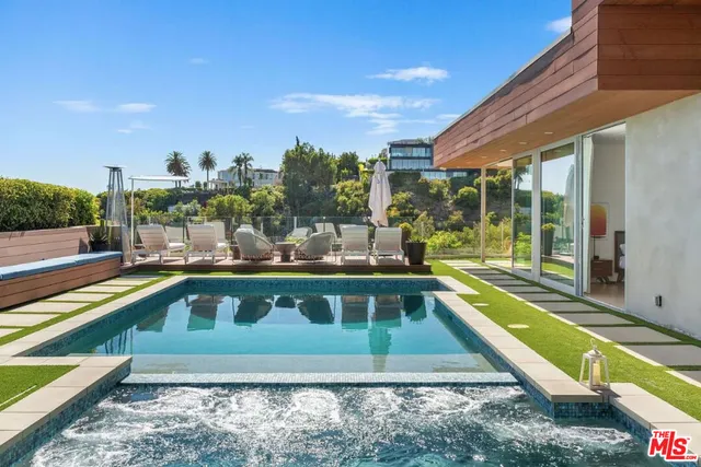 a view of a swimming pool with a patio